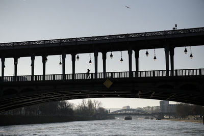 Bridge over river against clear sky