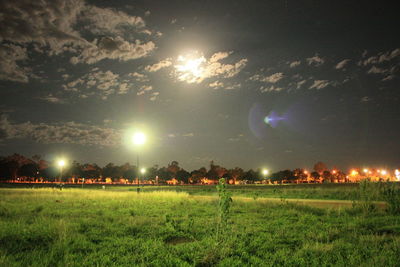 Scenic view of field against sky at night