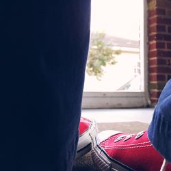 Close-up low section of man against sky