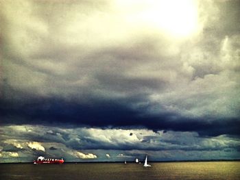 Scenic view of sea against cloudy sky