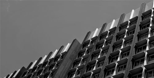 Low angle view of skyscraper against clear sky