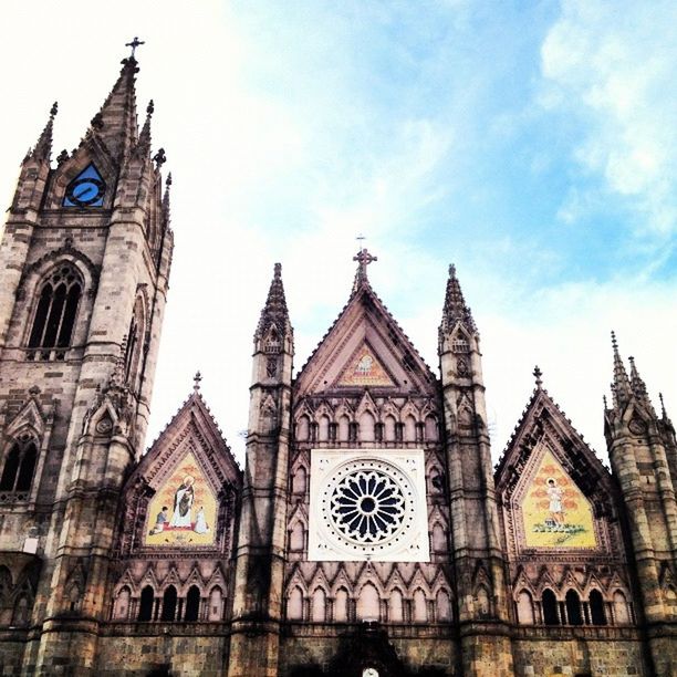 architecture, building exterior, religion, church, place of worship, built structure, spirituality, cathedral, low angle view, sky, facade, cross, history, arch, dome, outdoors, travel destinations, old