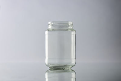 Close-up of glass bottle against white background