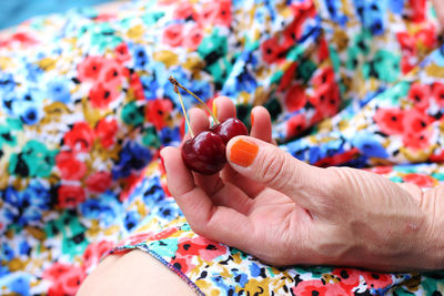 Close-up of hand holding fruits