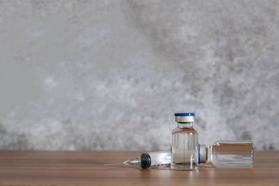 Close-up of glass bottle on table