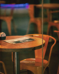 Close-up of empty chairs and table in restaurant