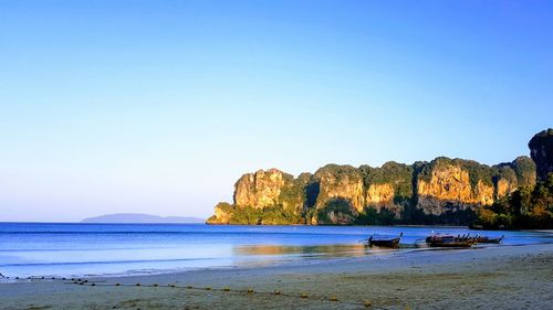 Scenic view of beach against blue sky