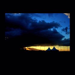 Built structure against cloudy sky at sunset