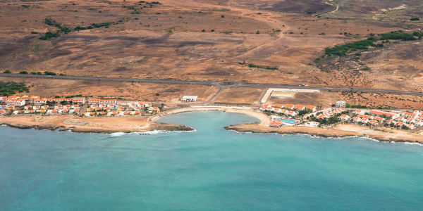 Aerial view of town by seashore