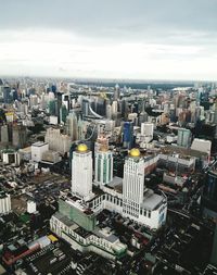 High angle view of buildings in city against sky