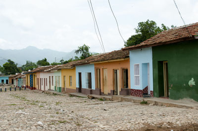 Houses against sky in city