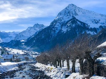 Scenic view of snowcapped mountains against sky