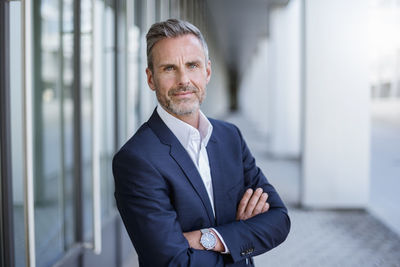 Portrait of businessman wearing blue suit coat and wrist watch