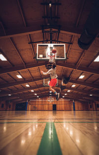 Low angle view of illuminated lights hanging on ceiling