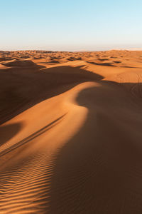 Scenic view of desert against clear sky