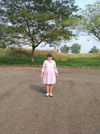 Full length of woman standing on field