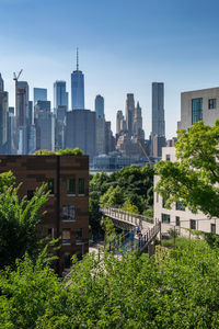 Buildings in city against sky