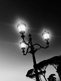 Low angle view of lamp post against sky