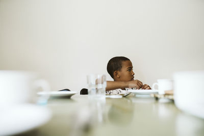 Boy sitting at table