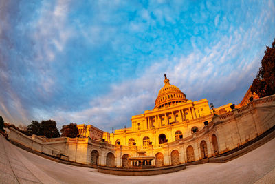 Low angle view of historical building against cloudy sky