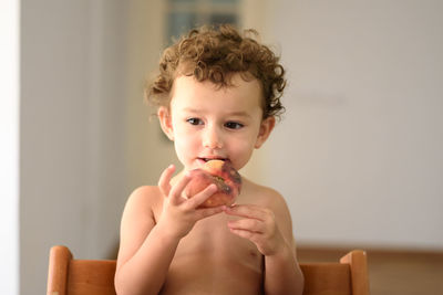 Portrait of boy eating food