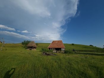 House on field against sky