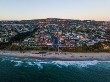 High angle view of buildings in city and ocean