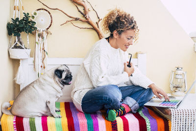 Mature woman using laptop while sitting at home