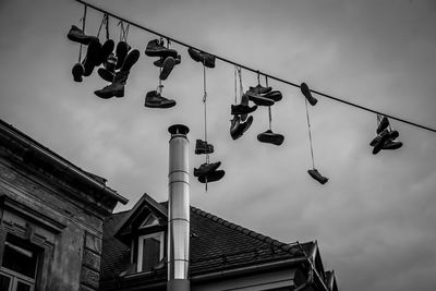 Low angle view of flags hanging against sky