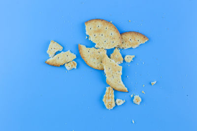 High angle view of bread on blue background