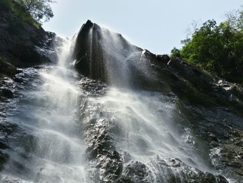 Scenic view of water flowing through rocks