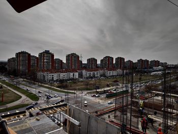 High angle view of city buildings against sky