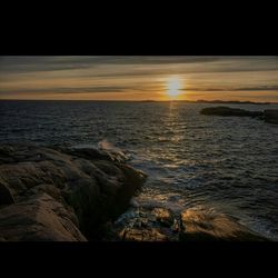 Scenic view of sea at sunset