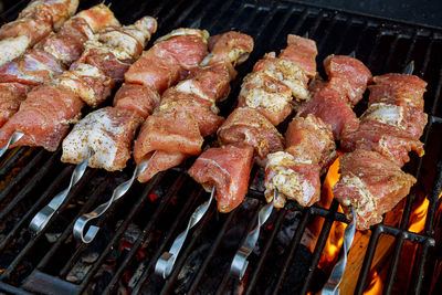 Close-up of meat on barbecue grill