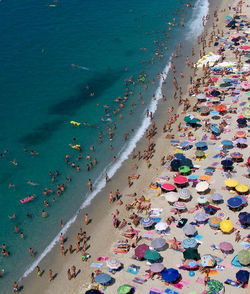 High angle view of people on beach against sky