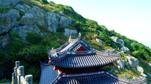 High angle view of building and trees against sky