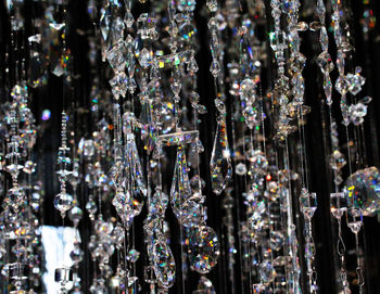 Full frame shot of glass decorations hanging in store