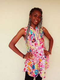 Portrait of a smiling young woman over white background