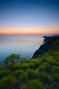 Scenic view of sea against sky during sunset