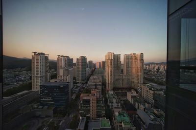 High angle view of buildings against sky during sunset