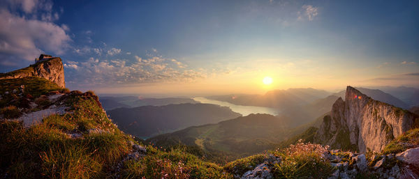 Panoramic view of mountains against sky during sunset