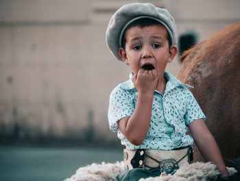 Cute boy looking through camera