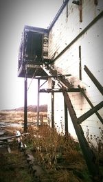 Old wooden structure on field