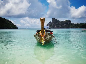 Boat in sea against sky