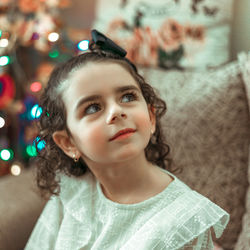 Portrait of cute girl looking away