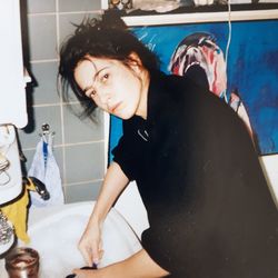 Young woman standing in bathroom at home