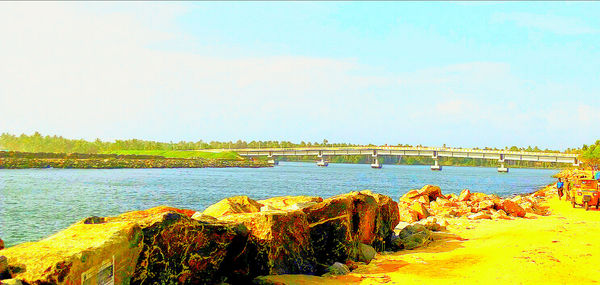 Scenic view of bay against clear sky