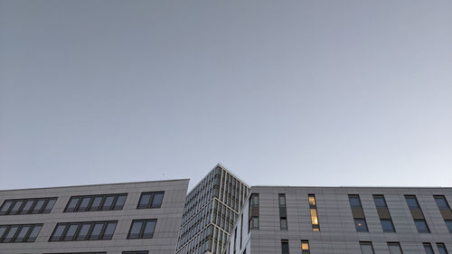 Low angle view of modern building against clear sky