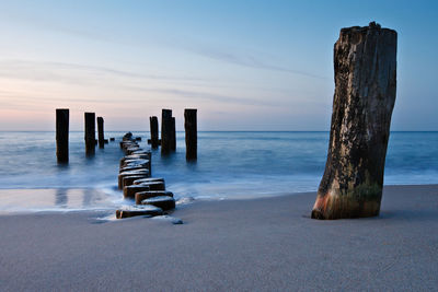 View of jetty at calm sea against the sky