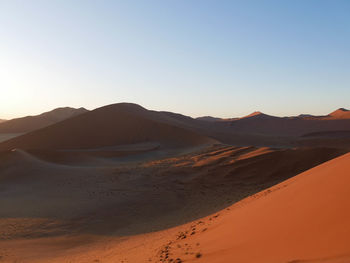 Scenic view of desert against clear sky